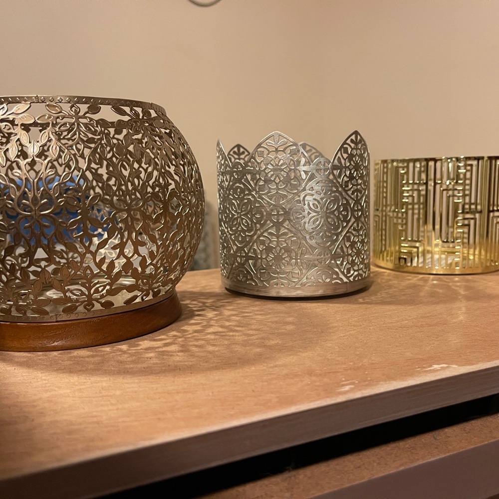 Intricate Metal Candle Holders with Decorative Cut-Out Patterns
